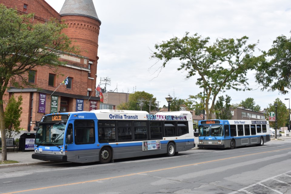 USED orillia transit buses in front of opera house