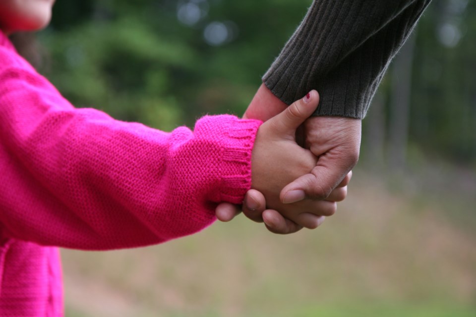 kid holding hands AdobeStock