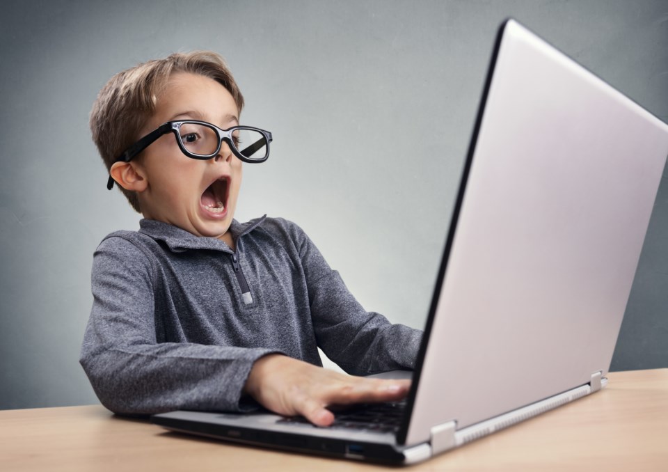 kid typing surprised stock