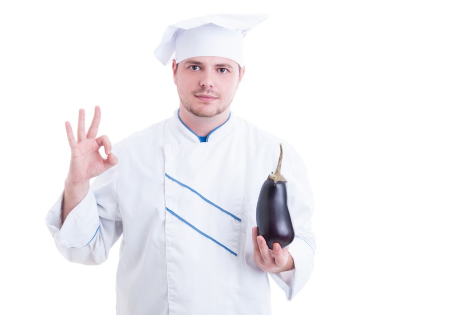 man holding eggplant