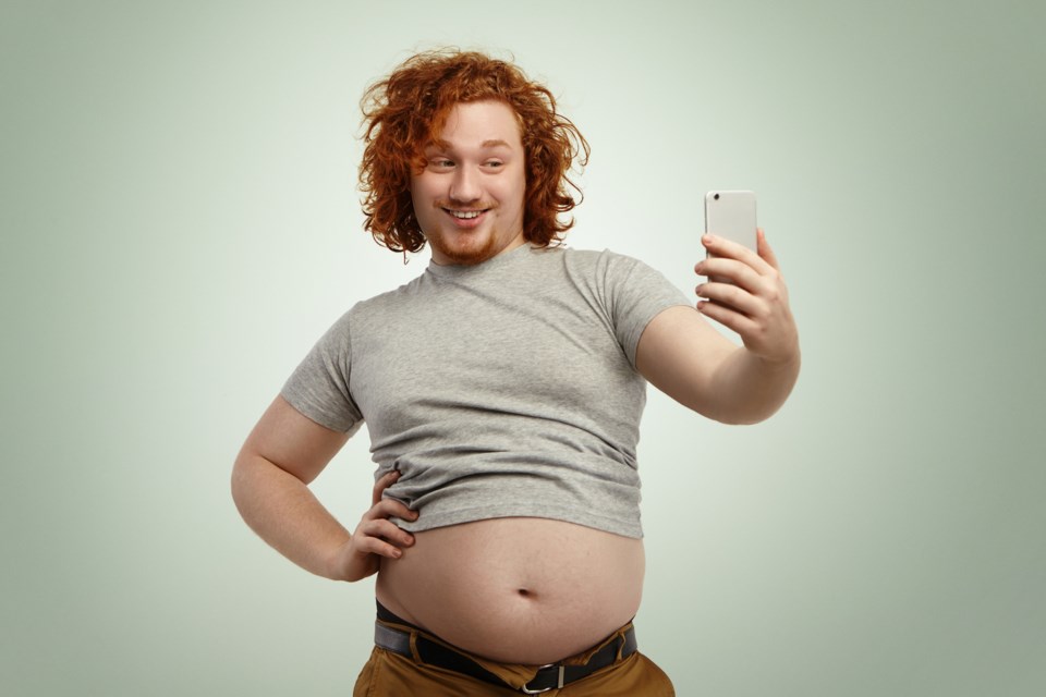 selfie belly gut stock