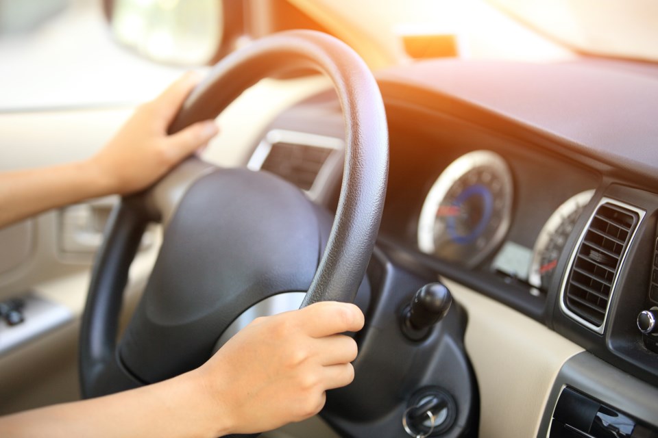 steering wheel woman stock