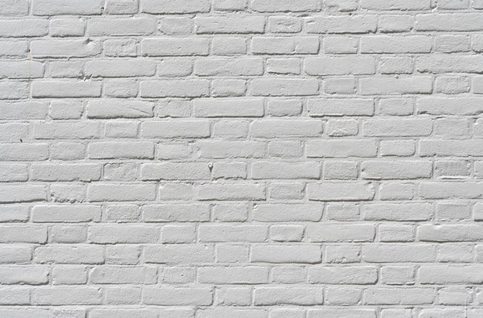 white brick wall stock