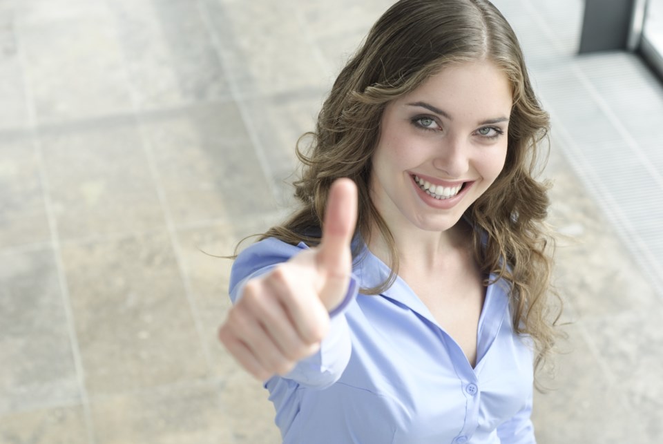 woman thumbs up AdobeStock_13267693