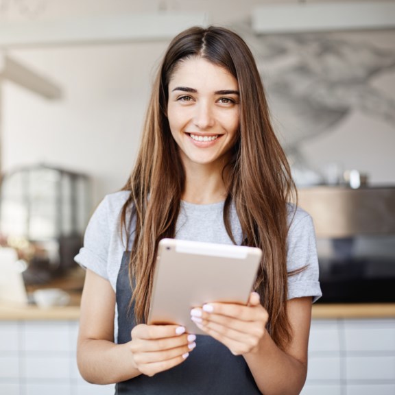 Business owner holding a tablet