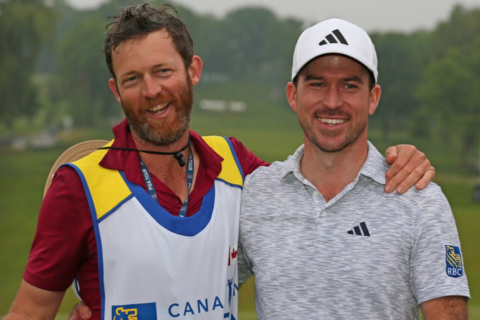 Caddie David Markle (left) is pictured with RBC Canadian Open champion Nick Taylor