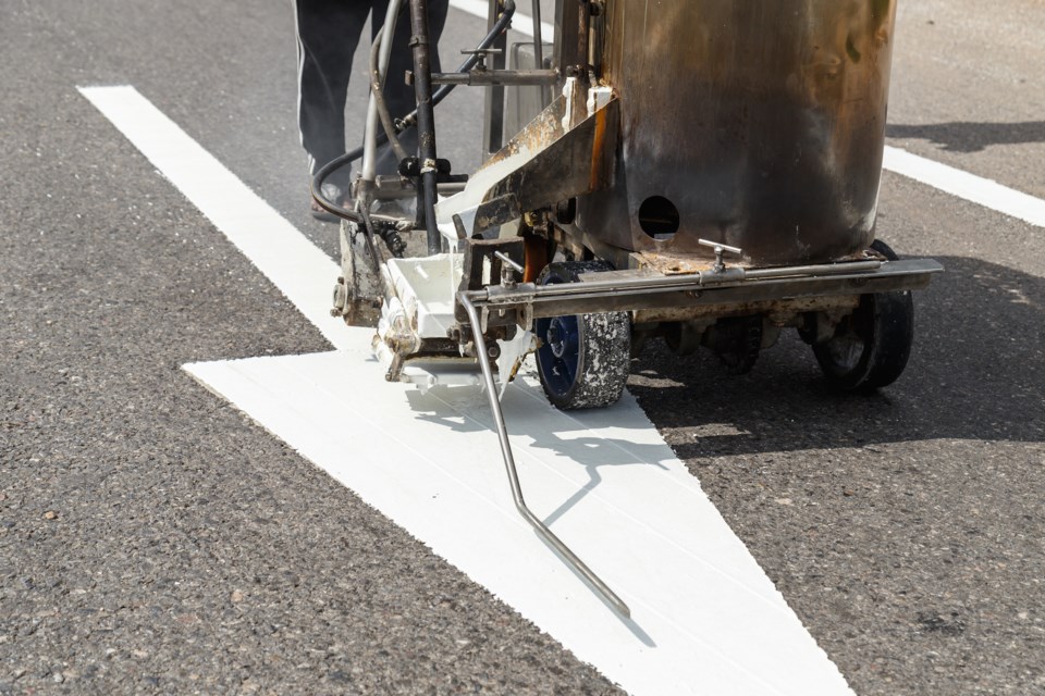 road line painting AdobeStock