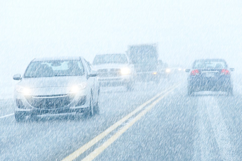 winter driving snowing AdobeStock_49094361