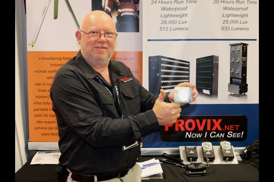 Dave Winfield of Provix Inc. showing off the new self-contained cordless Wisdom cap lamp that features long-lasting lithium ion batteries. Winfield was at the Big Event Mine Expo held in Timmins in June. 
LEN GILLIS / SMSJ 2019