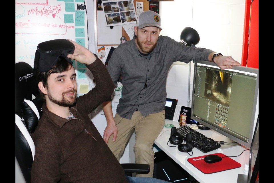 Virtual Reality specialists Michael Daoust, left,  and Andrew Kostuik at NORCAT are developing the 3D programs that will help new Vale workers learn how to safely operate pieces of mobile equipment as they prepare to work underground. (PHOTO: Len Gillis / SMSJ 2020)