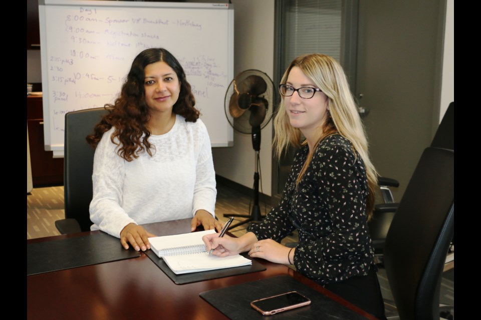 Planning is now underway for the third annual Beyond Digital Transformation conference to be held in Sudbury in February. PACE CEO Neha Singh (left) recently discussed details of the conference with Lindsay Lane, communications coordinator at NORCAT, which is one of the event partners. (Len Gillis/Sudbury Mining Solutions Journal)