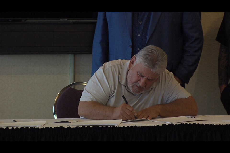 Chief Paul Gladu and Biinjitiwaabik Zaaging Anishinaabek, signs agreement with Asiniikaa Mining in Thunder Bay, Thursday, Oct. 27.
photo by: Vasilios Bellos TBnewsWatch.com