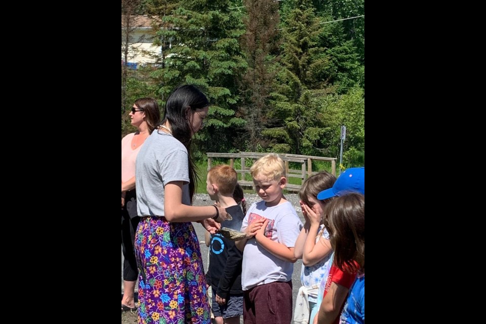 Students from St. Edward Catholic School participate in smudging ceremony. 
www.facebook.com/stedwardcatholicschool.com