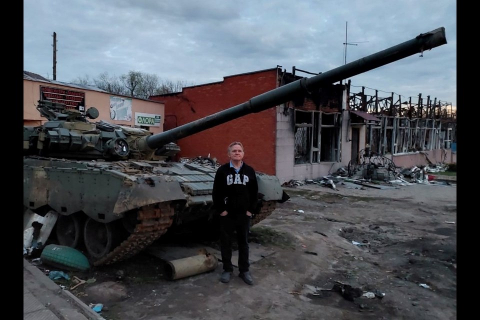 Ed Dickson with destroyed tank in Ukraine