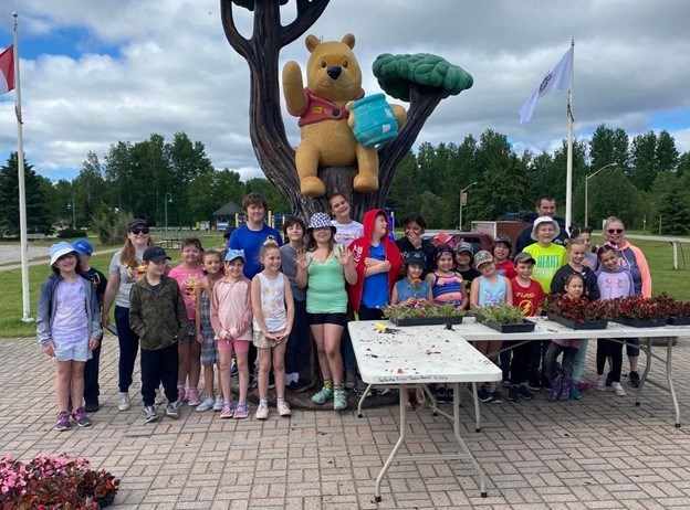 Group gathers to celebrate Winnie The Pooh Park flower planting
Facebook.comwhiteriver