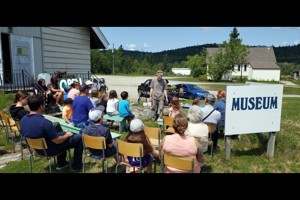 John Lavoie teaches a group of people about monarch butterflies. (Marya Kalen photo)