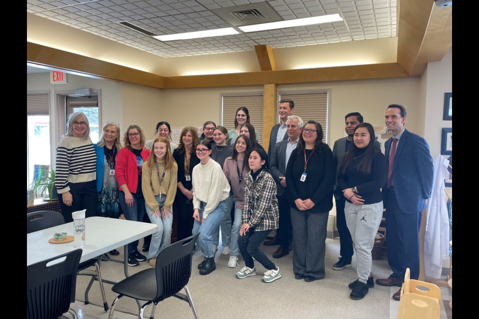 A group shot of ECE students, program administrators, Childcare and Family Centre management, and Ministers Hajdu and Anandsangaree.