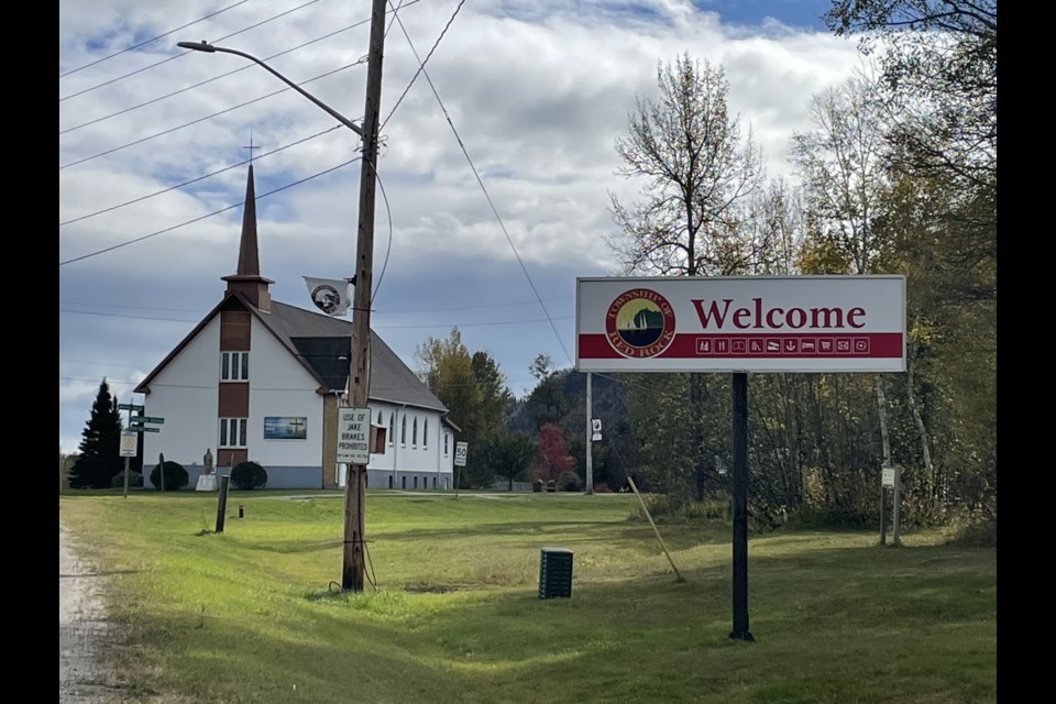 A shot of the welcome sign, entering Red Rock, displays one of the township's previous logos.