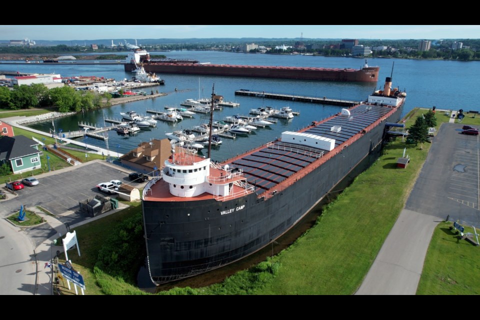 The Museum Ship Valley Camp with the largest freighter on the Great Lakes, Paul R. Tregurtha, in the background.