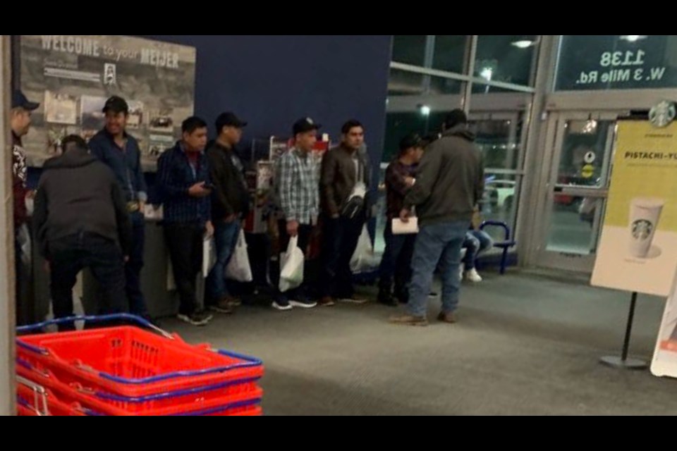 A shopper at Meijer took this picture Friday evening of the undocumented non-citizens inside the entryway.