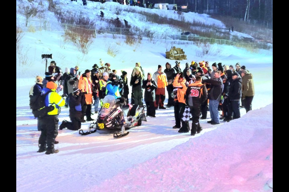 Justin Tate and Andy Wenzlaff of Nelson Racing captured the checkered flag at the I-500 snowmobile race Saturday, Feb. 5, 2022