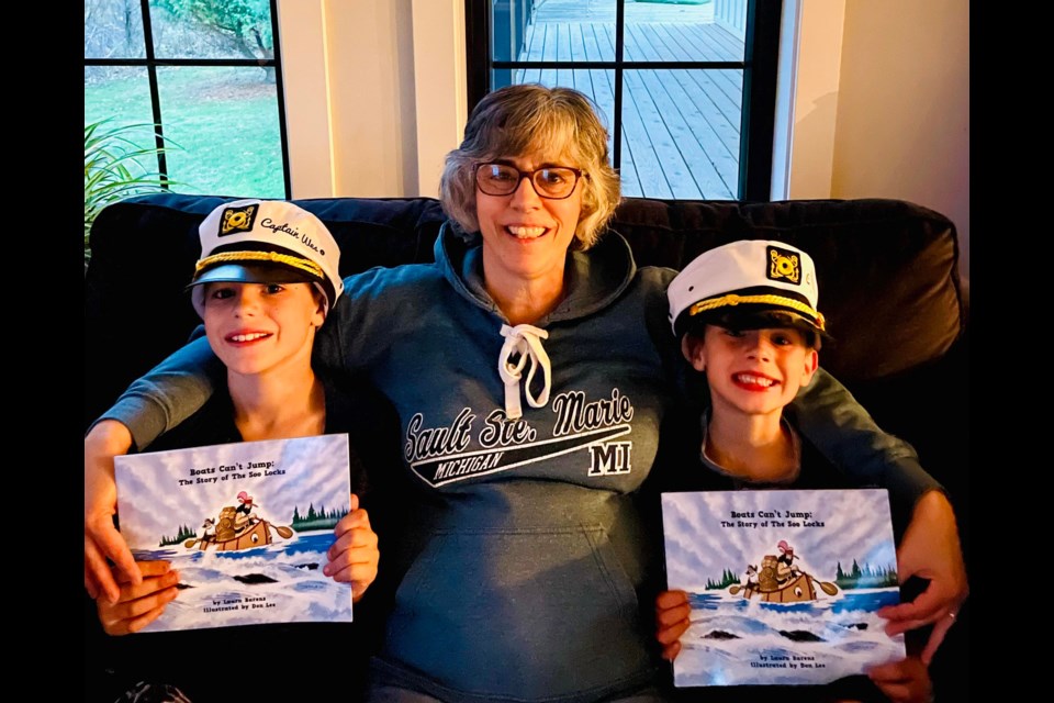 ‘Boats Can’t Jump: The Story of The Soo Locks’ Author Laura Barens with her grandchildren