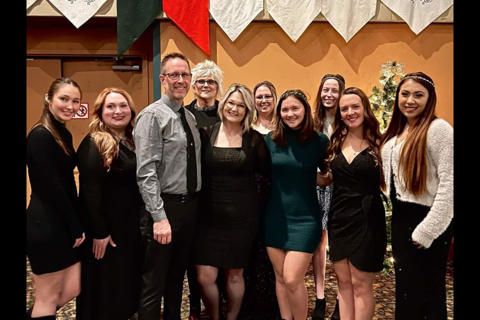 Randy and Jill Kennedy with their Sugar Daddy Bakery staff at Kewadin Casinos, while attending the Hospice of the EUP Madrigal Dinner in December.