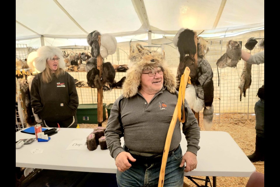 Bob Leflar of Chippewa Fur Traders sells authentic, iconic fur apparel at the 54th International 500 Snowmobile Race