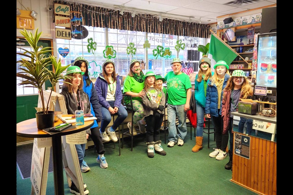 The 4-H ARTiculate Journalists club covered the Sixth Annual Saint Patrick's Day Parade Friday, March 17, 2023, lining up outside of Domino's Pizza and walking to Cup of the Day with the Stackpoole family