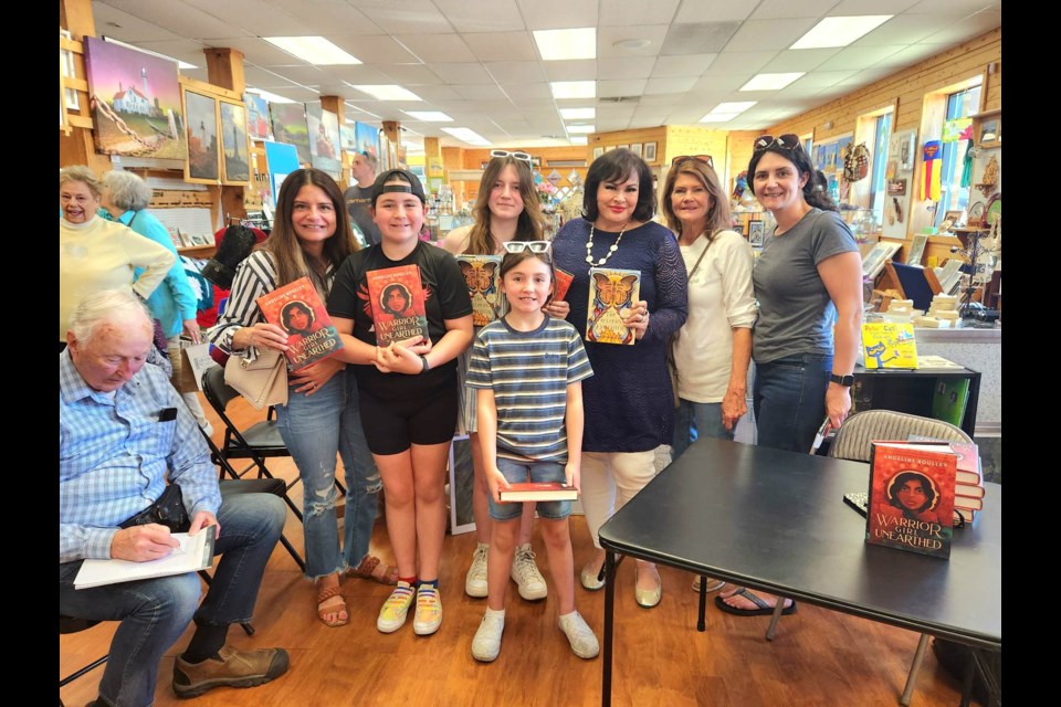 Angeline Boulley with fans at Island Books and Crafts to sign "Warrior Girl Unearthed," sequel to "The Fire Keeper's Daughter," on Saturday, May 27, 2023