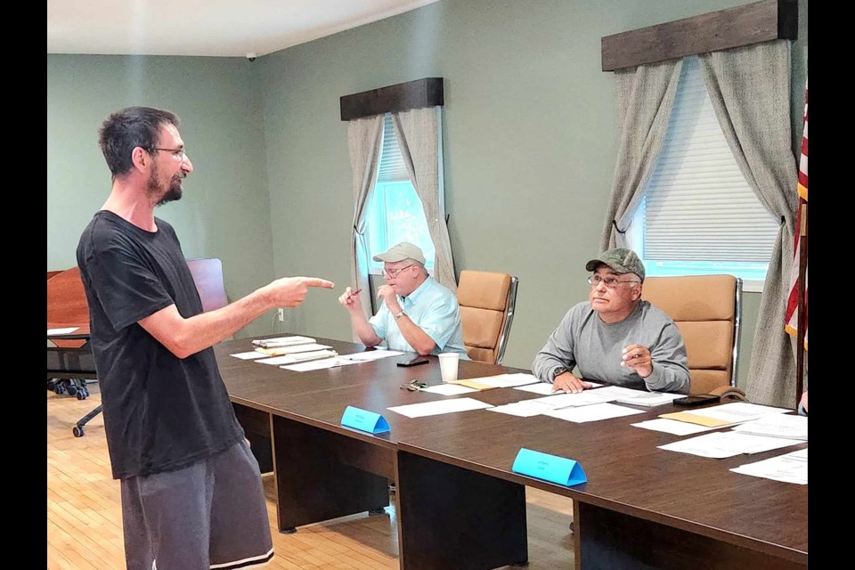 Former Lakeshore Drive resident Richard Scott interrupts Superior Township meeting on Tuesday, June 27, 2023 after losing his animals and belongings to a fire the prior morning 