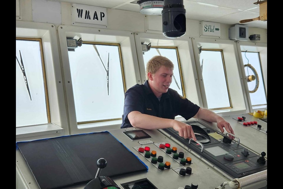 Great Lakes Maritime Academy Cadet Jason Glass provides visitors with mock control and navigation demonstrations aboard Training Ship STATE OF MICHIGAN on Engineers Day, Friday, June 30, 2023