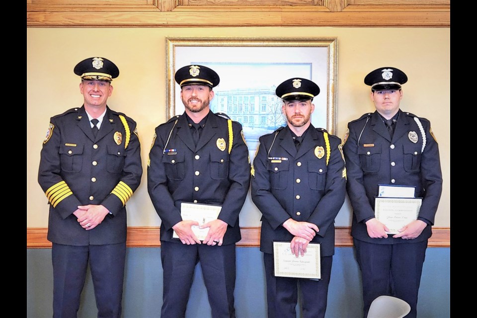 City of Sault Ste. Marie Police Chief Wesley Bierling stands alongside Sgt. Christopher Stempky, Sgt. Jerome Gapczynski, and Officer Trevor Adkins after presenting each with Lifesaving Commendation Awards at a regular city commission meeting on June, 5, 2023