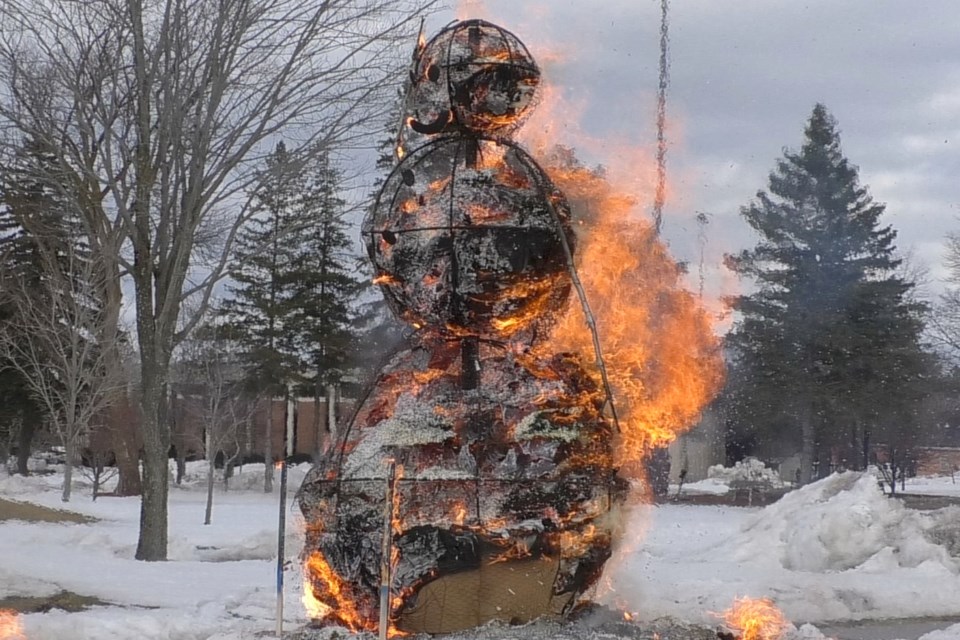 Lake Superior State University continues its 52-year tradition of setting fire to an enormous skeleton of wood covered in straw, wire, paint, and artful white paper to celebrate the beginning of spring
