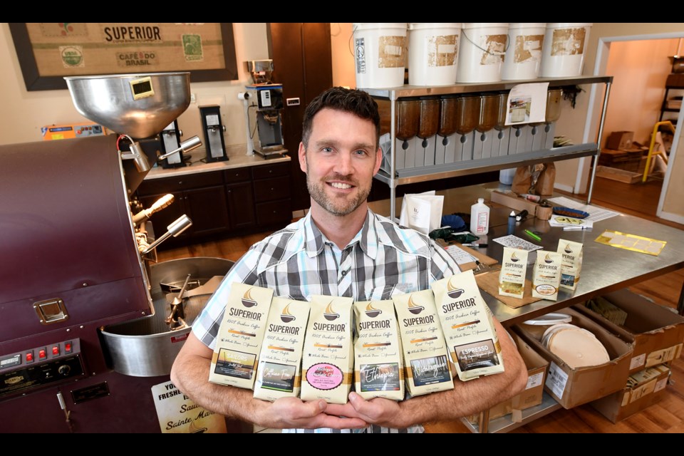 Ron Kurnik with six bestselling coffees.