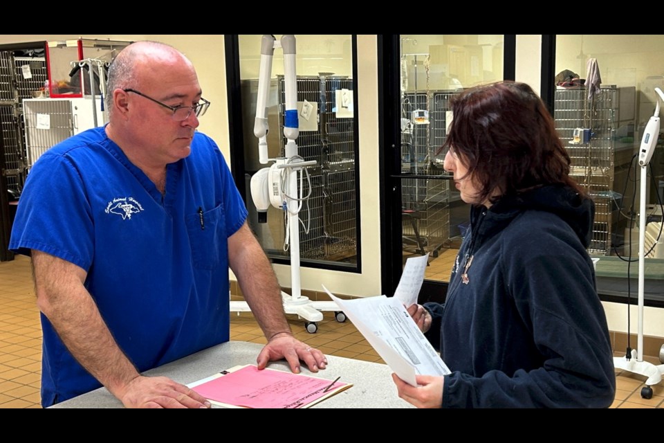 Sault Animal Hospital's Dr. Jeff LaHuis (left) offers advanced veterinary treatments at his clinic in Sault Mich.