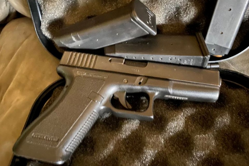 A handgun seized by Michigan State Police at the scene.