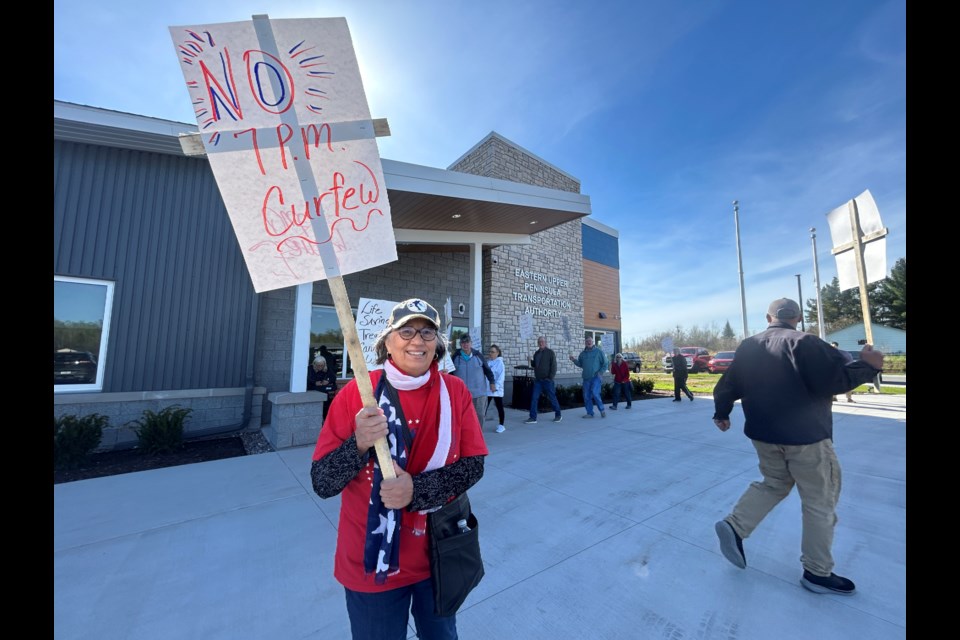 Before the 10:30 a.m. EUPTA board meeting, several people picketed outside the EUPTA building.