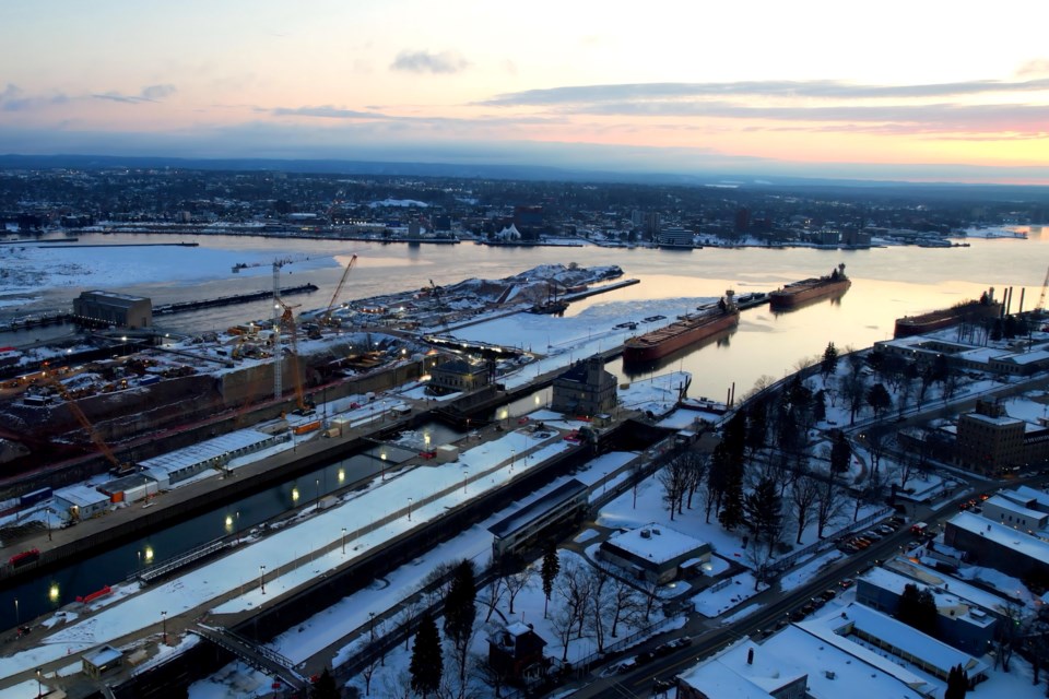The tug/barge Clyde S. VanEnkevort/Erie Trader was the first freighter through the Soo Locks Friday morning.