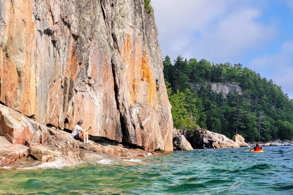 The Agawa Pictograph Site, called Mazinaubikiniguning by the Ojibwe people who made the pictographs, is located on this 15-storey tall, crystalline granite cliff. 