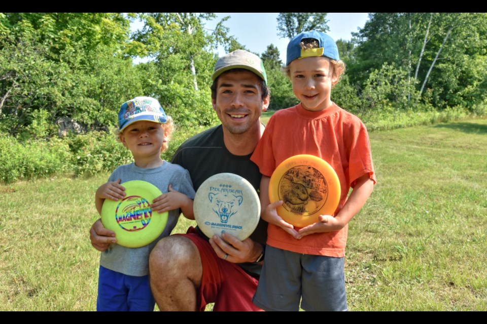 Seth Whitley with his sons, Leo (left) and William (right) opening day