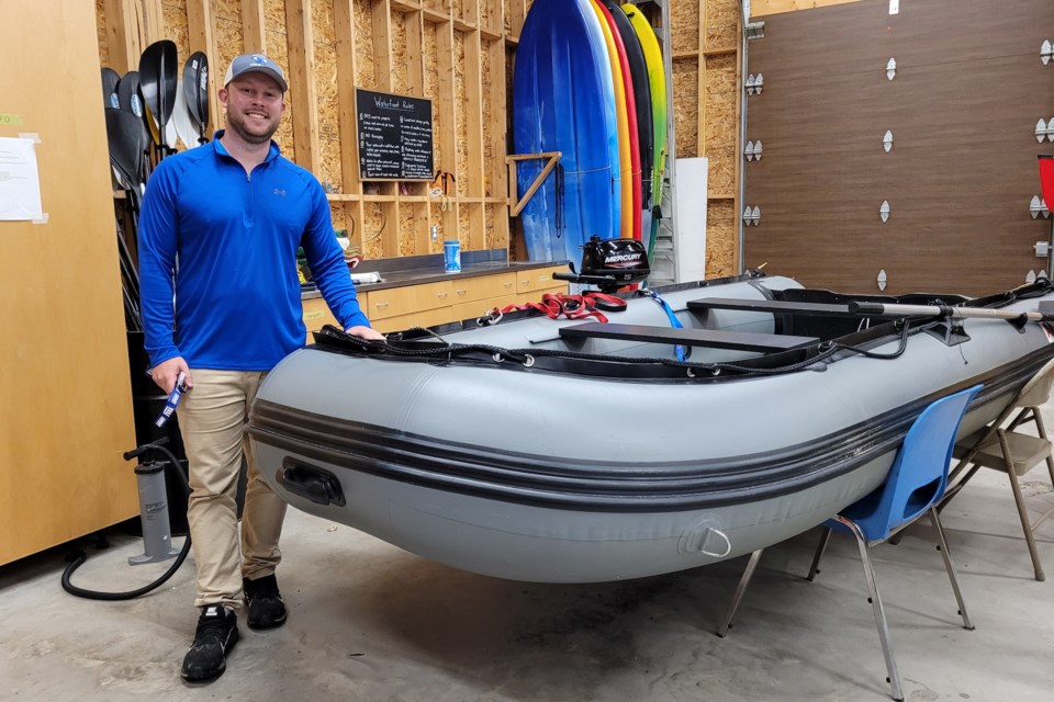 Phil Dittburner, waterfront and recreation supervisor, shows off the rescue boat available to staff at the Sault College Waterfront Adventure Centre.