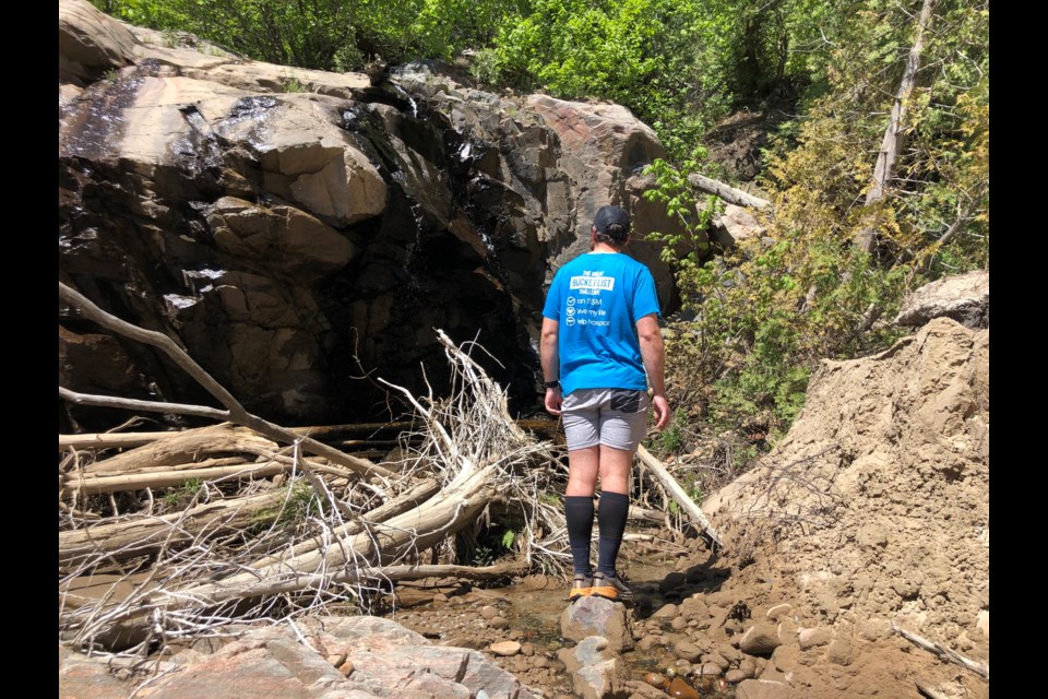 Jonathan Mogg runs every street in Sault Ste. Marie to raise funds for ARCH. Jon is at the end of a street in the middle of a construction site. 