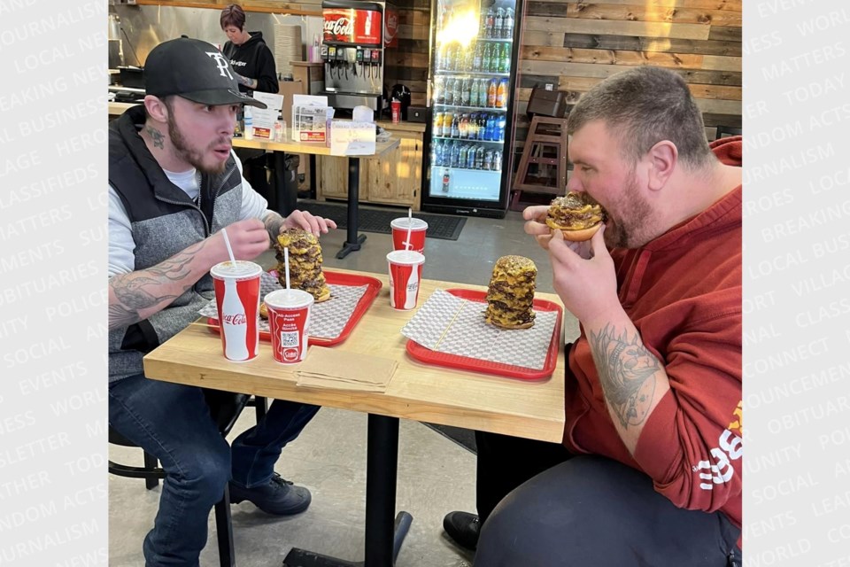 Eyeing an impressive record together, Jade Bryant (left) and Jeremy Wheten each consumed a 14-patty cheeseburger en route to defeatng the "Stackburger Challenge" on Jan. 17, 2024.