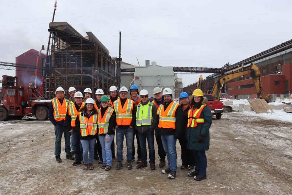 In the foreground is a delegation from the Ontario Building Officials Association Northern Lights Chapter, with connections to the existing Steel Shop (BOSP) and No. 2 Ladle Metallurgy Furnace in the background on Jan. 25, 2023.