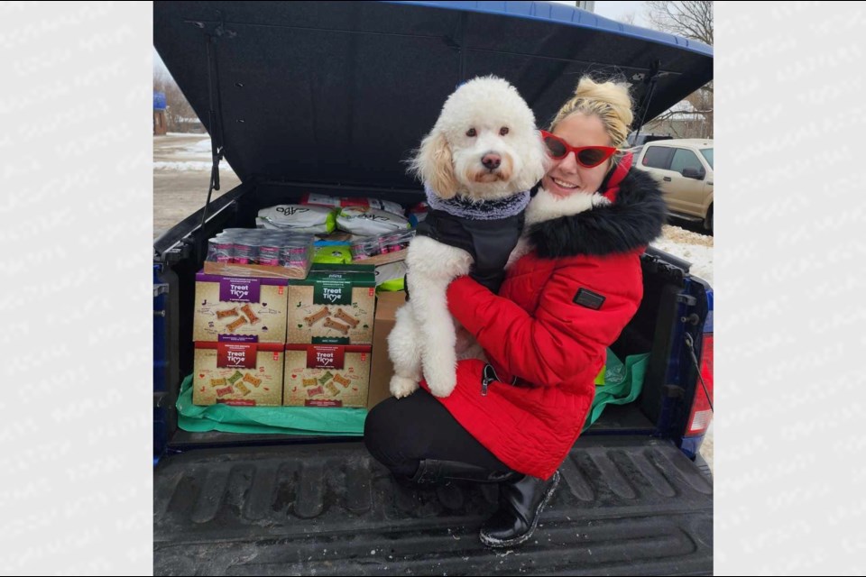 Allen's Side Road resident Rosa Carello and her pup Prince donated $4,000 worth of items to the Humane Society after overseeing a successful winter wonderland fundraiser at her home last month.