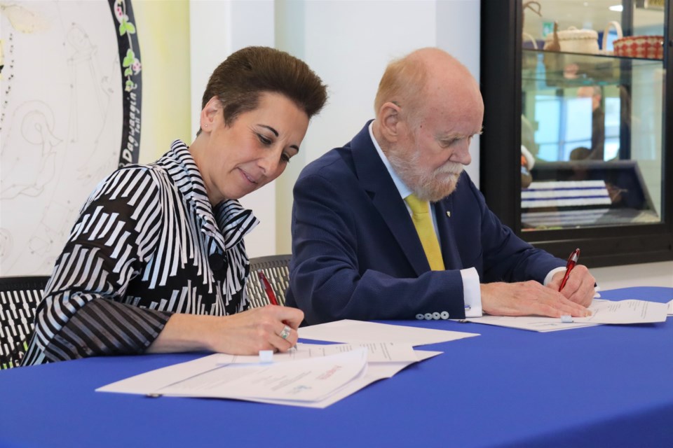 Algoma University president Asima Vezina (left) and Sault College president Dr. Ron Common (right) signed a new diploma to degree pathway agreement on Feb. 21, 2023, which will allow the college's Social Service Worker graduates to enter year three of the university's Bachelor of Social Work. 