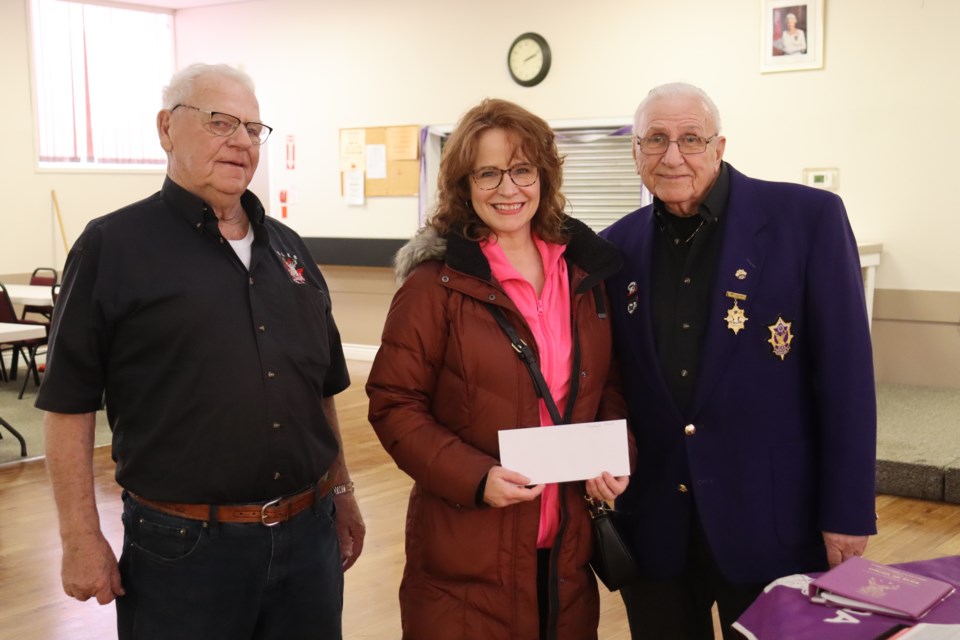 Lynne Palumbo from Tracey's Dream is presented with a $2,500 cheque at the Elks Lodge in Sault Ste. Marie on Feb. 21, 2023, which will go towards helping local cancer patients pay for parking at the hospital.