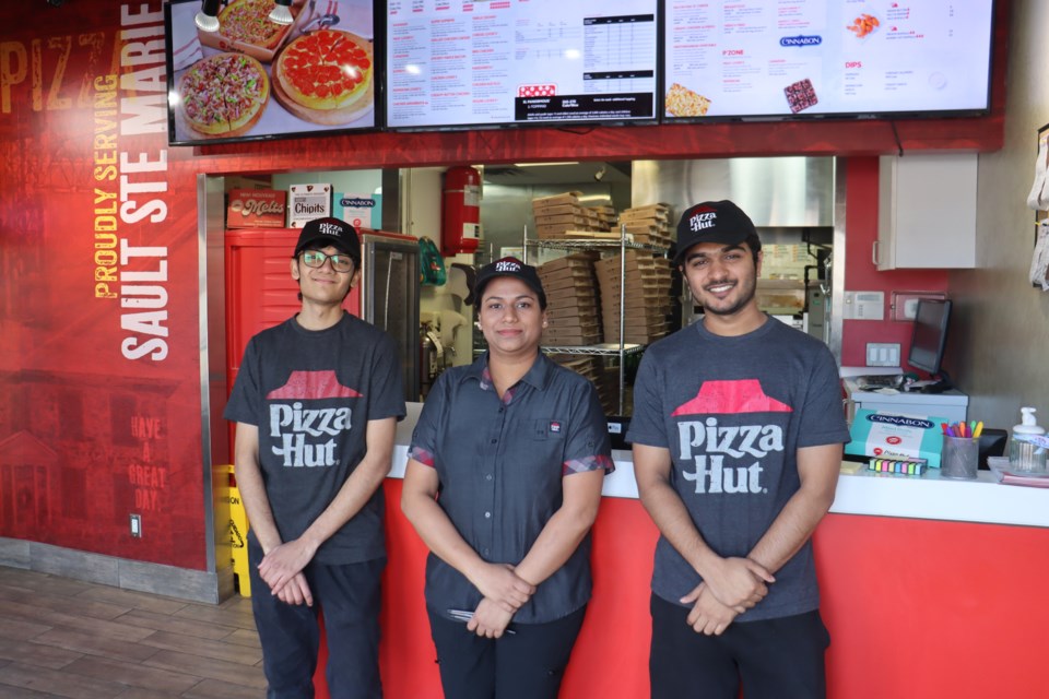 Great Northern Road's Pizza Hut employees Pratham Gandhi, Mansi Goyal, and Chirag Patel have been helping feed the homeless and hungry members of the community through the 'Hut to Heart' initiative; store's new owners Hardik and Himanshu Soni are running the 60-day fundraiser at all eight of their Pizza Hut locations in Ontario