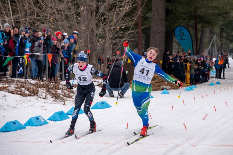 Jasper Tchir (right) hustles to the finish line during the 2024 Ontario Youth Championships at Hiawatha Highlands.